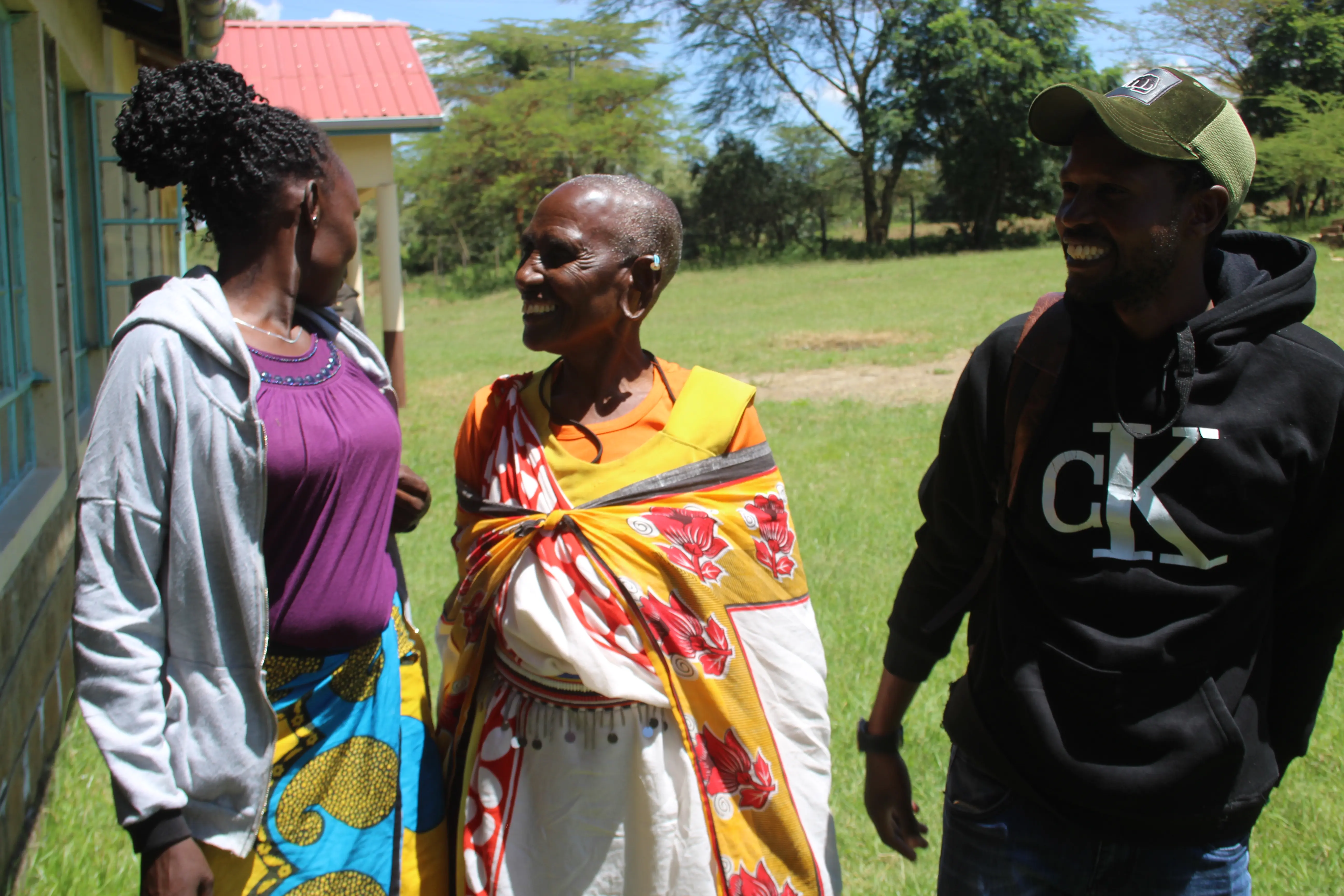 Mama Pauline (middle) togethor with her youngest son and daughter in law