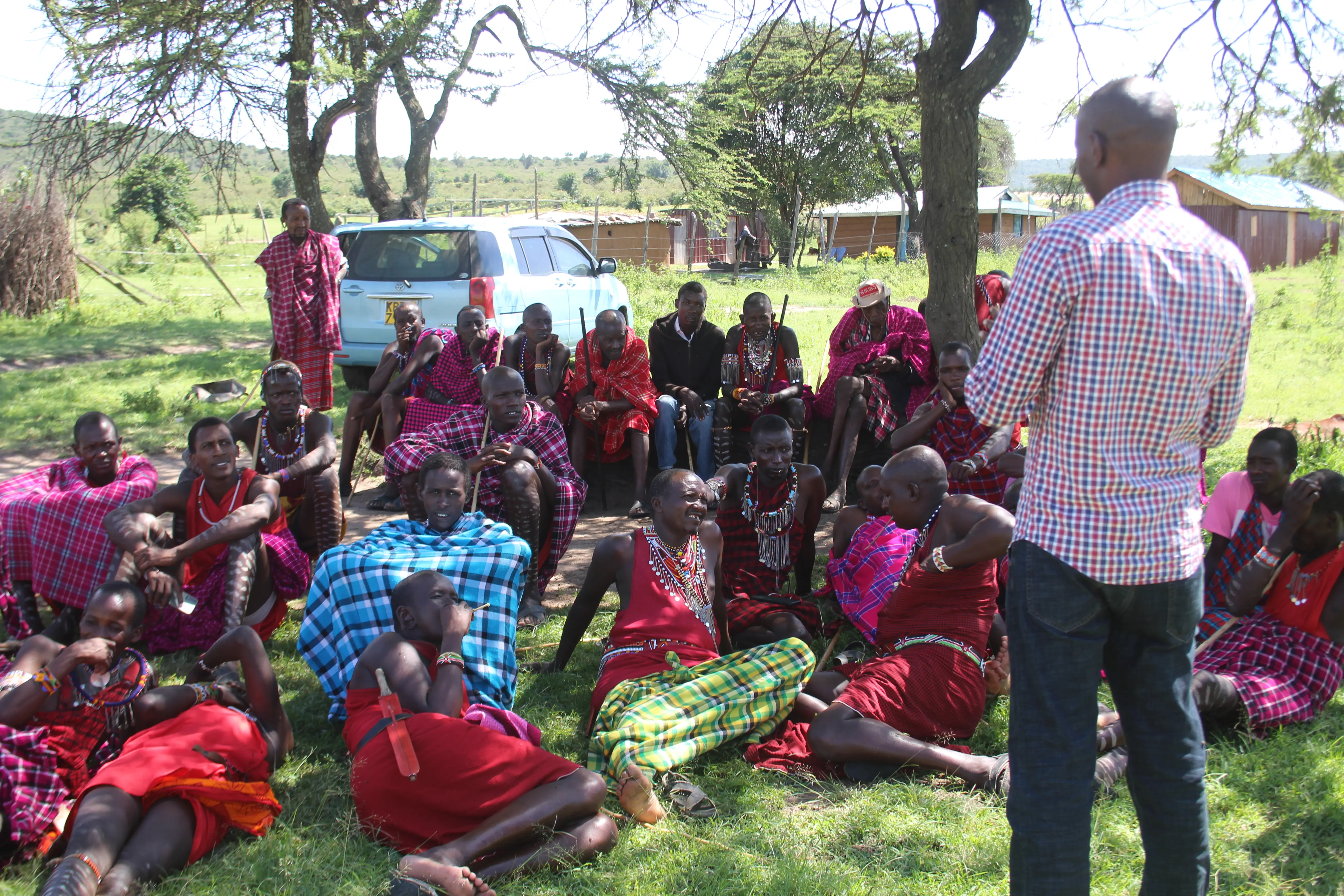 A Facility Clinical Officer engages the Maasai Men at Sekenani area during a forum to sensitize on Family Planning