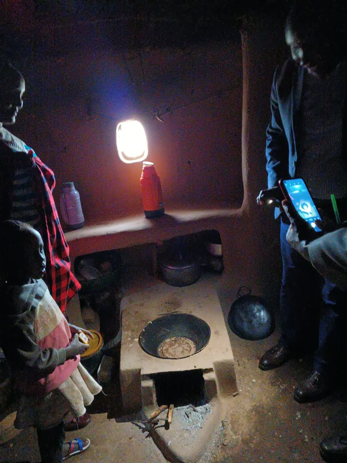 One of the women explaining how the improved jiko works