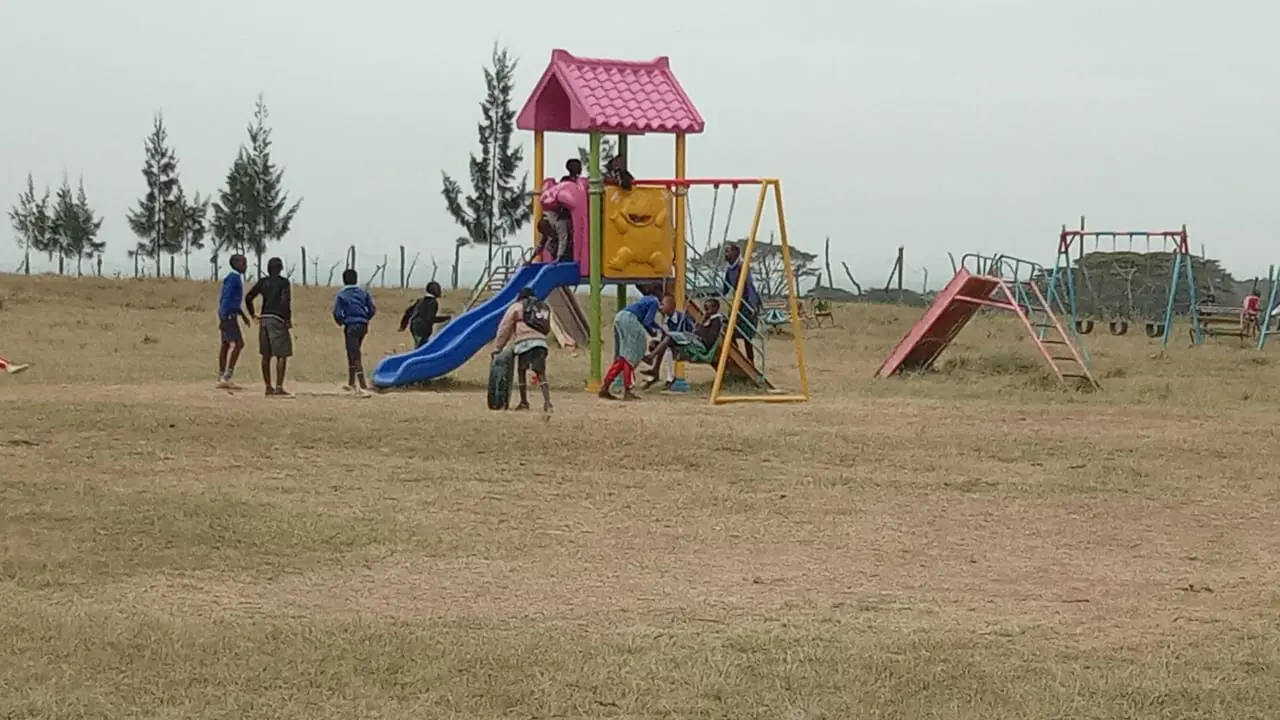 Project children playing in the compound during their class break